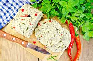 Cheese homemade with hot pepper and knife on board