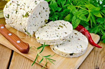 Cheese homemade with hot pepper and rosemary on board