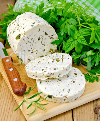 Cheese homemade with spices and napkin on board