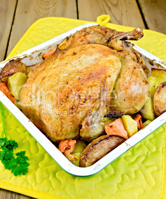 Chicken baked with vegetables in tray and parsley