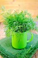 Dill fresh in a green mug