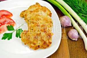 Fritters chicken with green onions on board