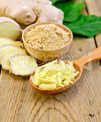 Ginger powder and grated on board with root and leaves