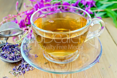 Herbal tea from fireweed in cup with strainer