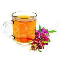 Herbal tea with bergamot in glass mug