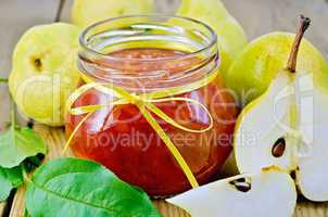 Jam pear with pears and leaves on board