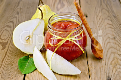 Jam pear with pears and spoon on board