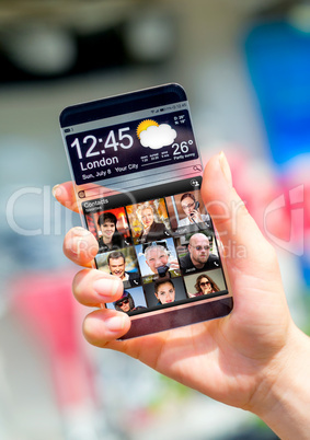 Smartphone with transparent screen in human hands.