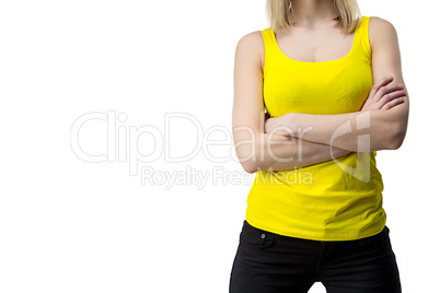 Woman in yellow T-shirt with arms crossed