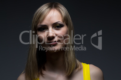 Portrait of a girl with makeup in shadow