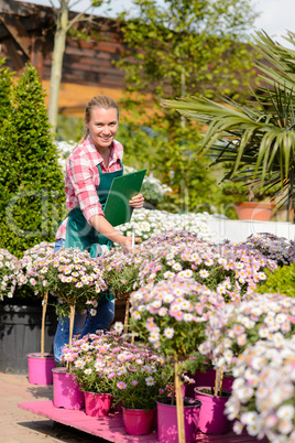 happy woman make inventory garden shopping center