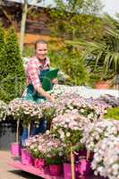 happy woman make inventory garden shopping center