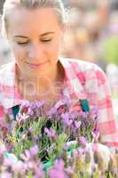 garden center woman with purple potted plant