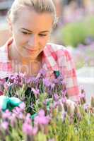 garden center woman with purple plant flower