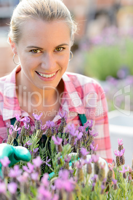 smiling woman with purple flower garden center