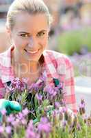 smiling woman with purple flower garden center