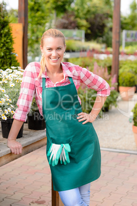 garden center smiling woman worker looking camera