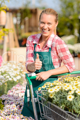 garden center smiling woman flowers thumb up