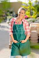 garden center woman worker posing in apron