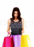 Girl looking in shopping bag.
