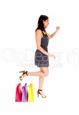 Woman standing with bag's.