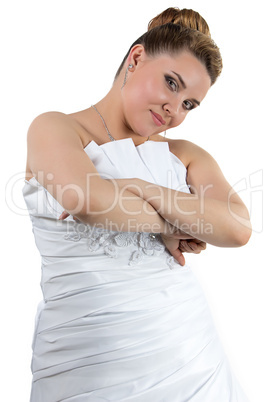 Woman in white wedding dress with arms crossed