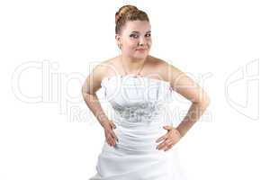 Woman in wedding dress with hands ob her waist