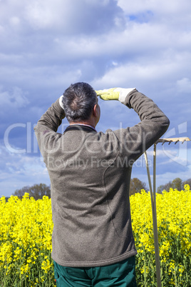 Farmer with hand tools in the field
