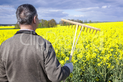 Farmer with hand tools in the field