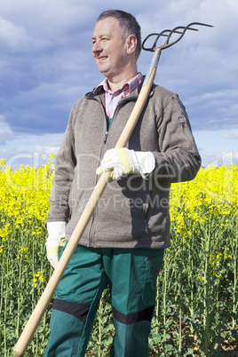 Farmer with fork on the field