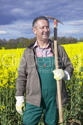 Farmer with shovel in the field