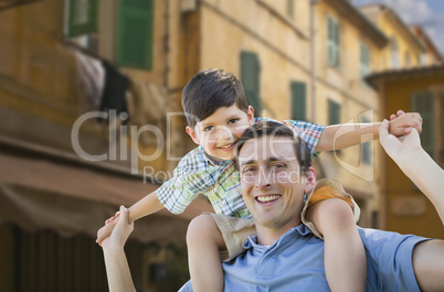 Father and Son Playing Piggyback on Streets of France