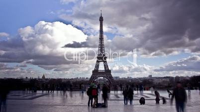 View of Eiffel Tower with a pan up. A large crowd. Time Lapse on Februrary 24, 2014 in Paris, France.