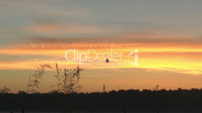 hot-air balloon gliding through beautiful dawn