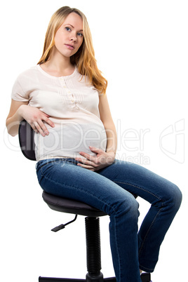 Pregnant woman with tummy sitting