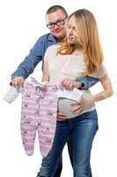 Father and pregnant wife with cloth for baby