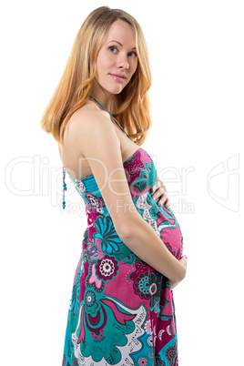Pregnant woman with tummy standing in dress
