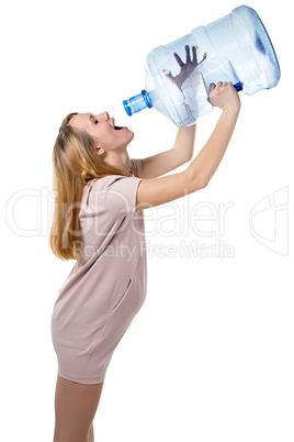 Funny pregnant woman drinking from bottle