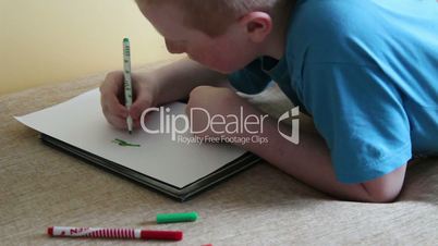 boy draws felt pen green ninja