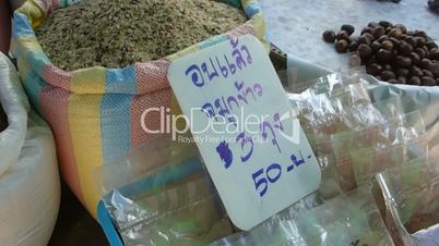 Vendors displaying varieties of raw rice in a market, Chiangmai, Thailand