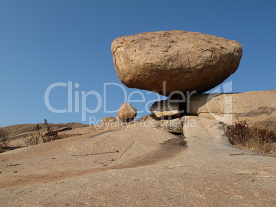 Balancing granite boulder