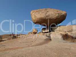 Balancing granite boulder