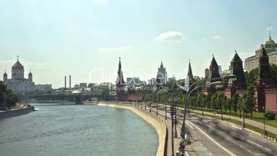 MOSCOW, RUSSIA - 26 May 2014: City traffic along Kremlin, Red Square in Moscow, Russia.