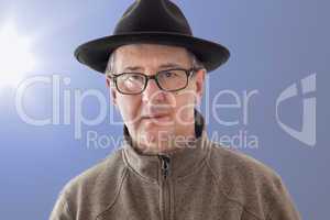 Serious man with hat and anxious glance