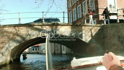 Shot from a boat. Helm of boat. Bruges, Belgium.