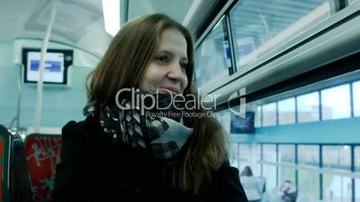 Young woman traveling by train.