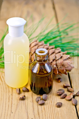 Oil and lotion with cedar cone on board