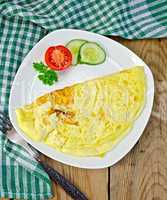 Omelet with green napkin on board