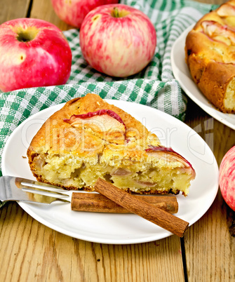 Pie with apples on plate and board
