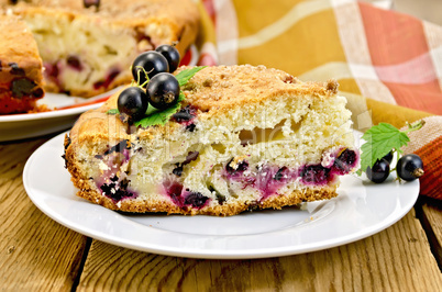 Pie with black currant on board with napkin